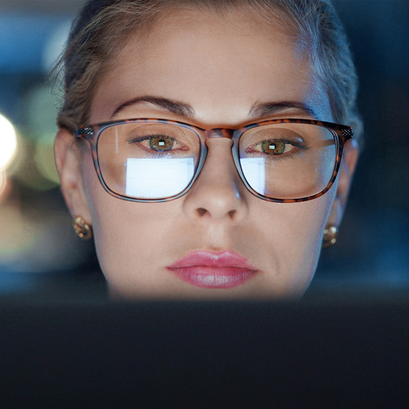 woman staring at computer screen