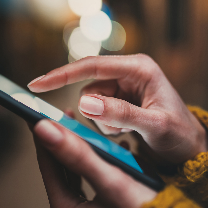 point finger on screen phone closeup, person texting text message, hipster touch blue screen on smartphone light night city, girls using in hands mobile phone close up, online wi-fi