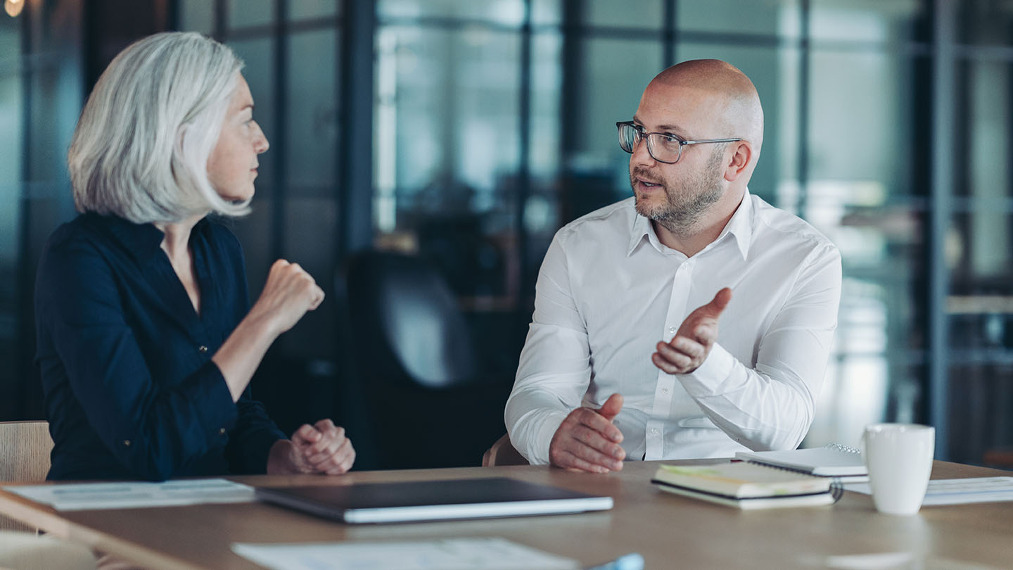 2 people in a meeting
