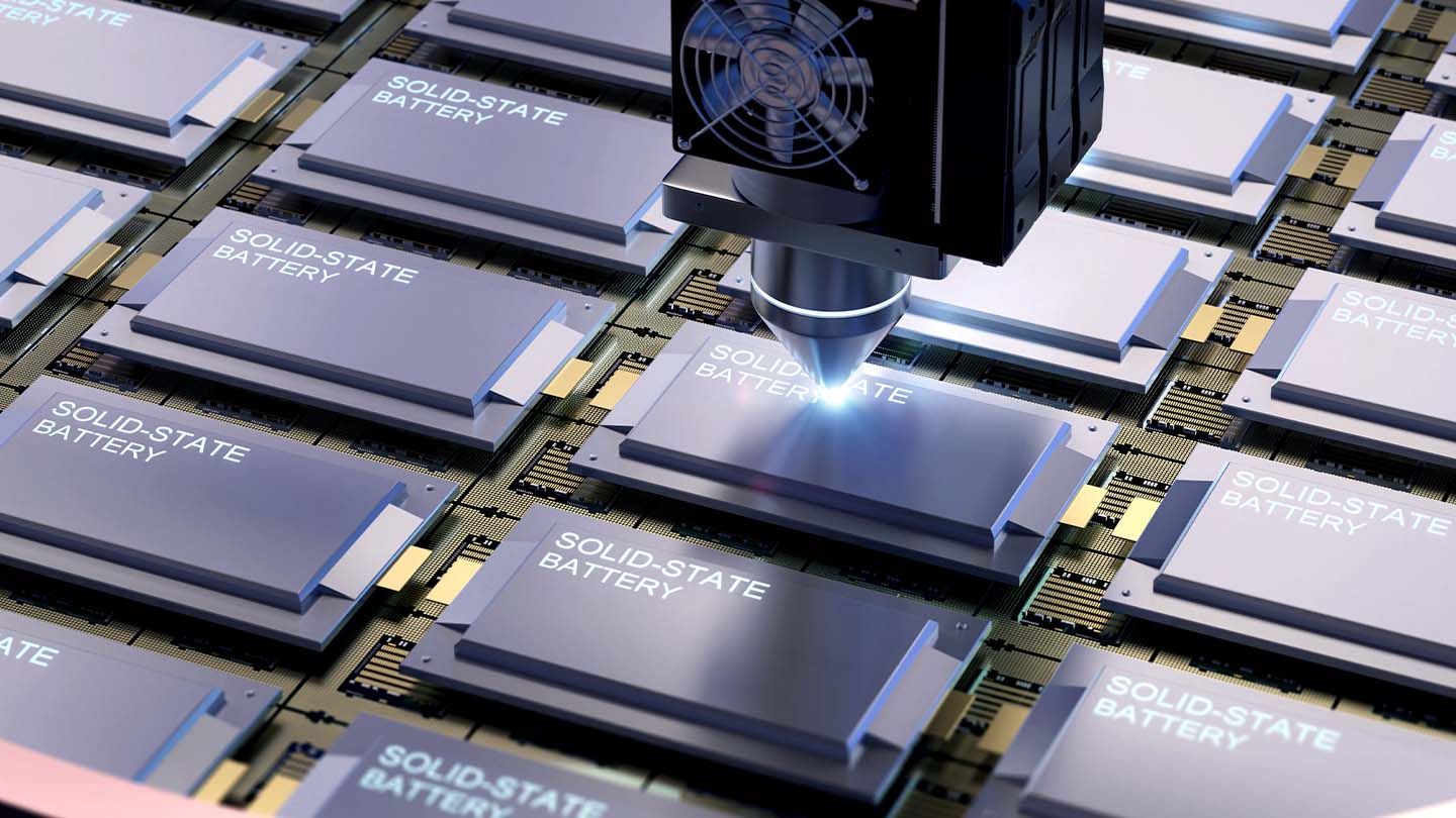 Solid-state batteries being manufactured with a robotic machine.