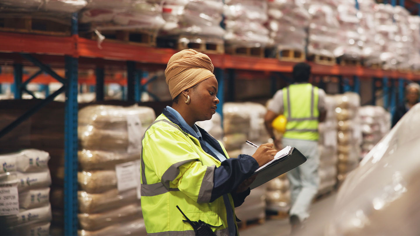 2 people working inside a warehouse