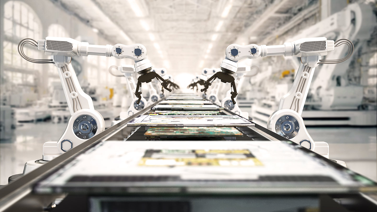 Robotic arms assembling electronic components on a conveyor belt in a modern factory.