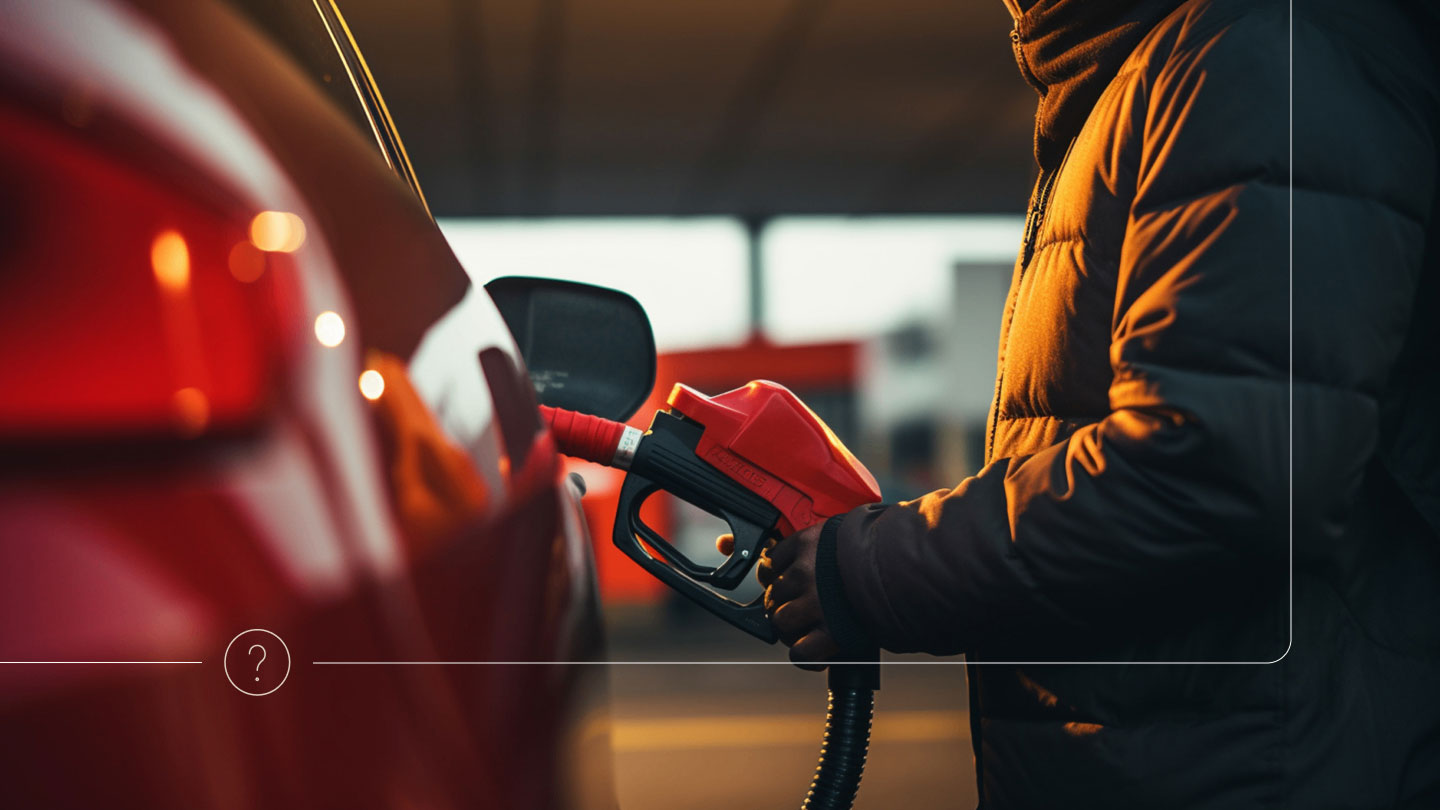 person injecting gasoline into car