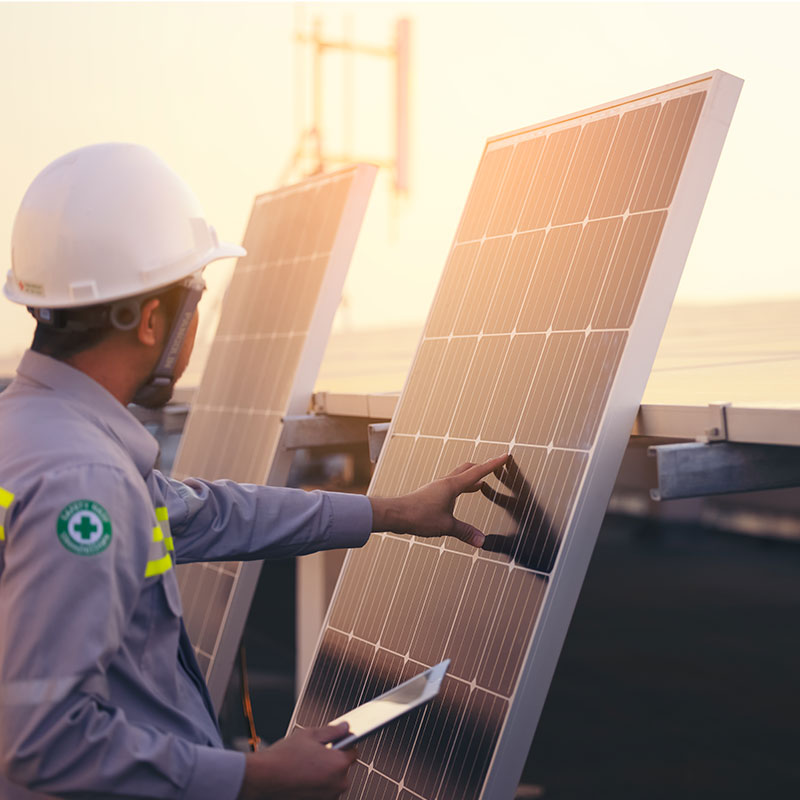 man installing solar panels