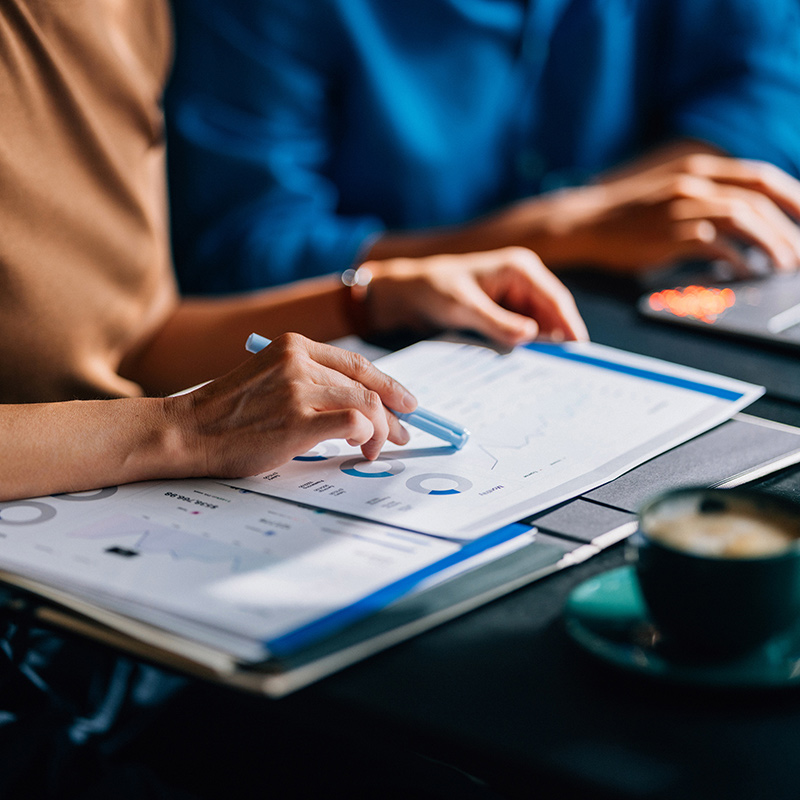 2 people worrking on data sheets